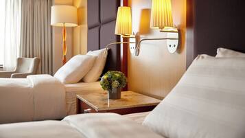 Premium bedding, down comforters, minibar, in-room safe