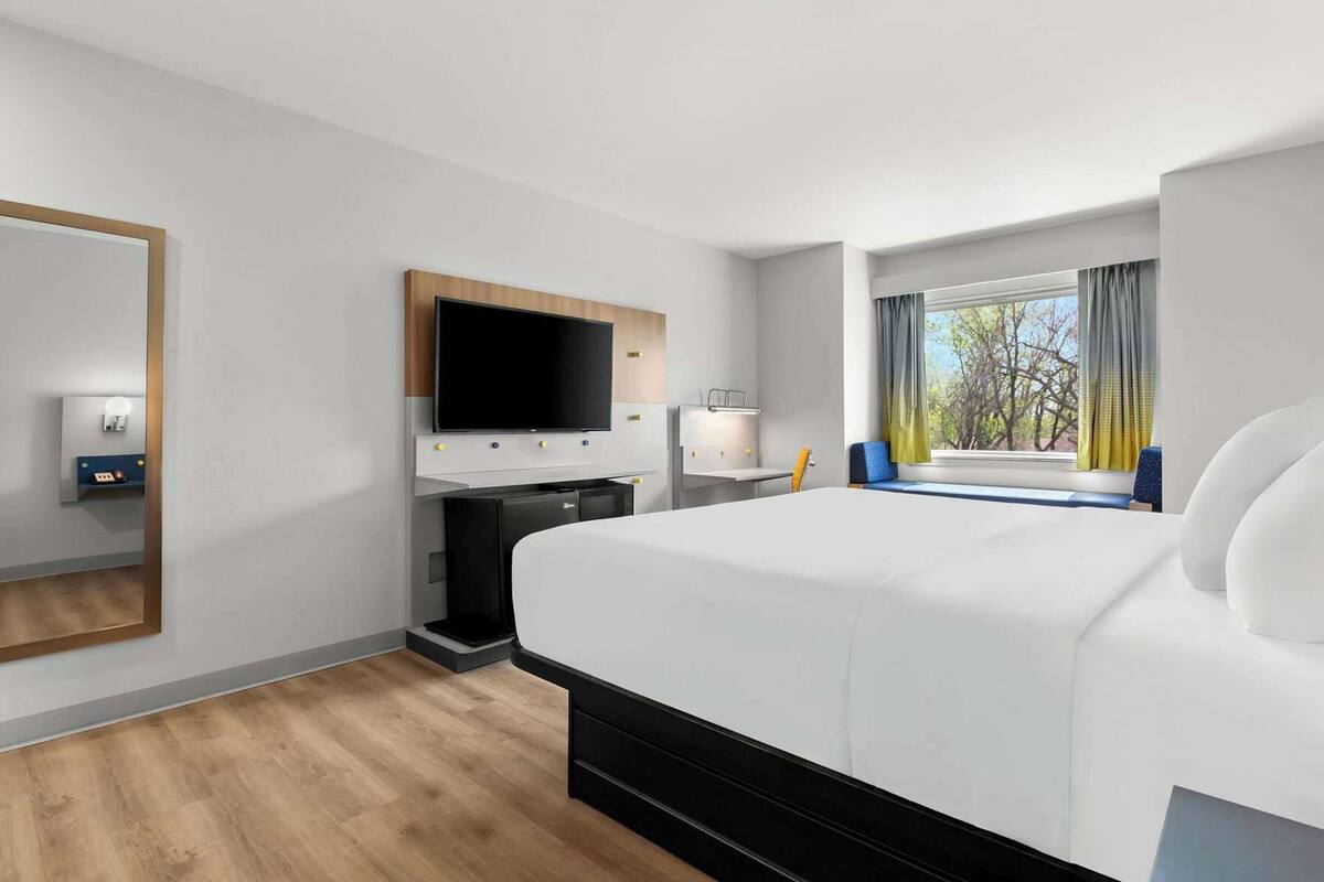 Premium bedding, laptop workspace, blackout drapes, iron/ironing board