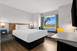 Premium bedding, laptop workspace, blackout curtains, iron/ironing board