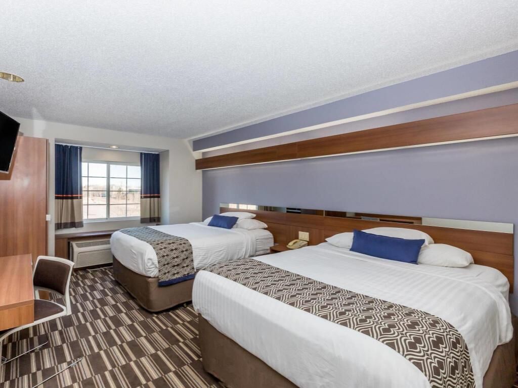 Down comforters, pillowtop beds, desk, iron/ironing board