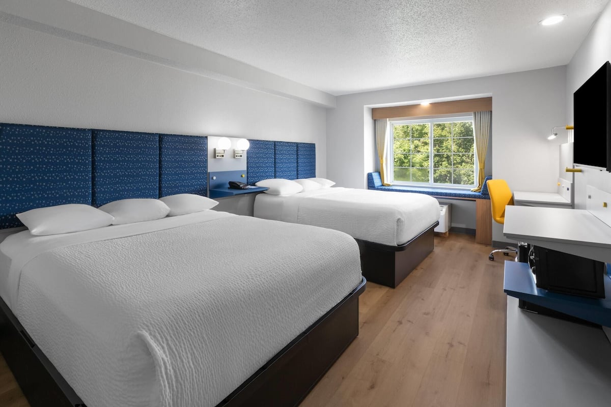 Down duvets, pillow-top beds, desk, iron/ironing board