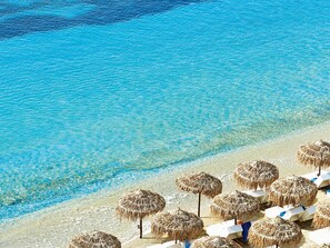 On the beach, sun-loungers, beach umbrellas, beach towels - Mykonos Blu, A Grecotel Resort to Live (Mykonos)