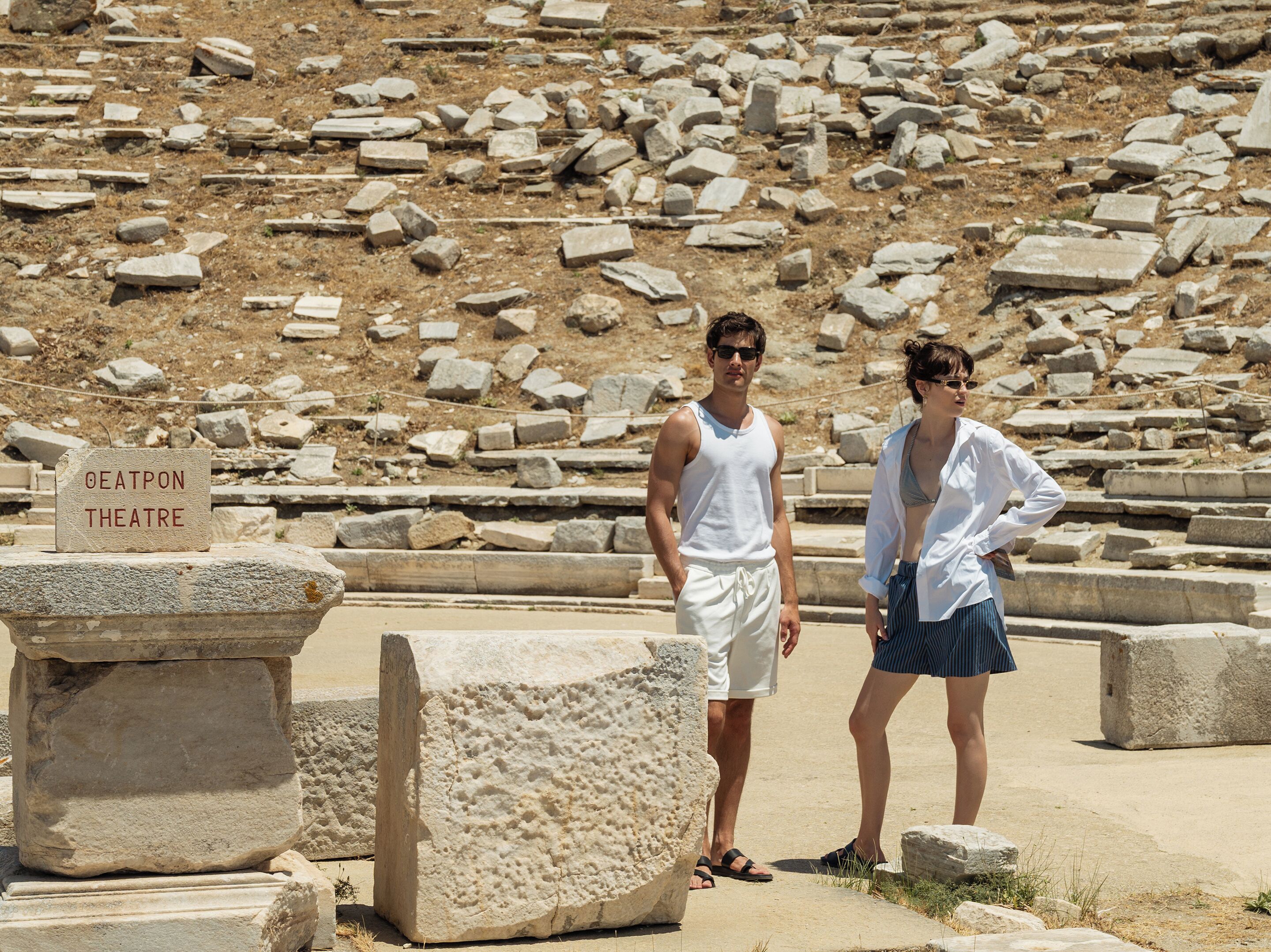A historical site with ruins and a sign reading 'OATPON THEATRE'.