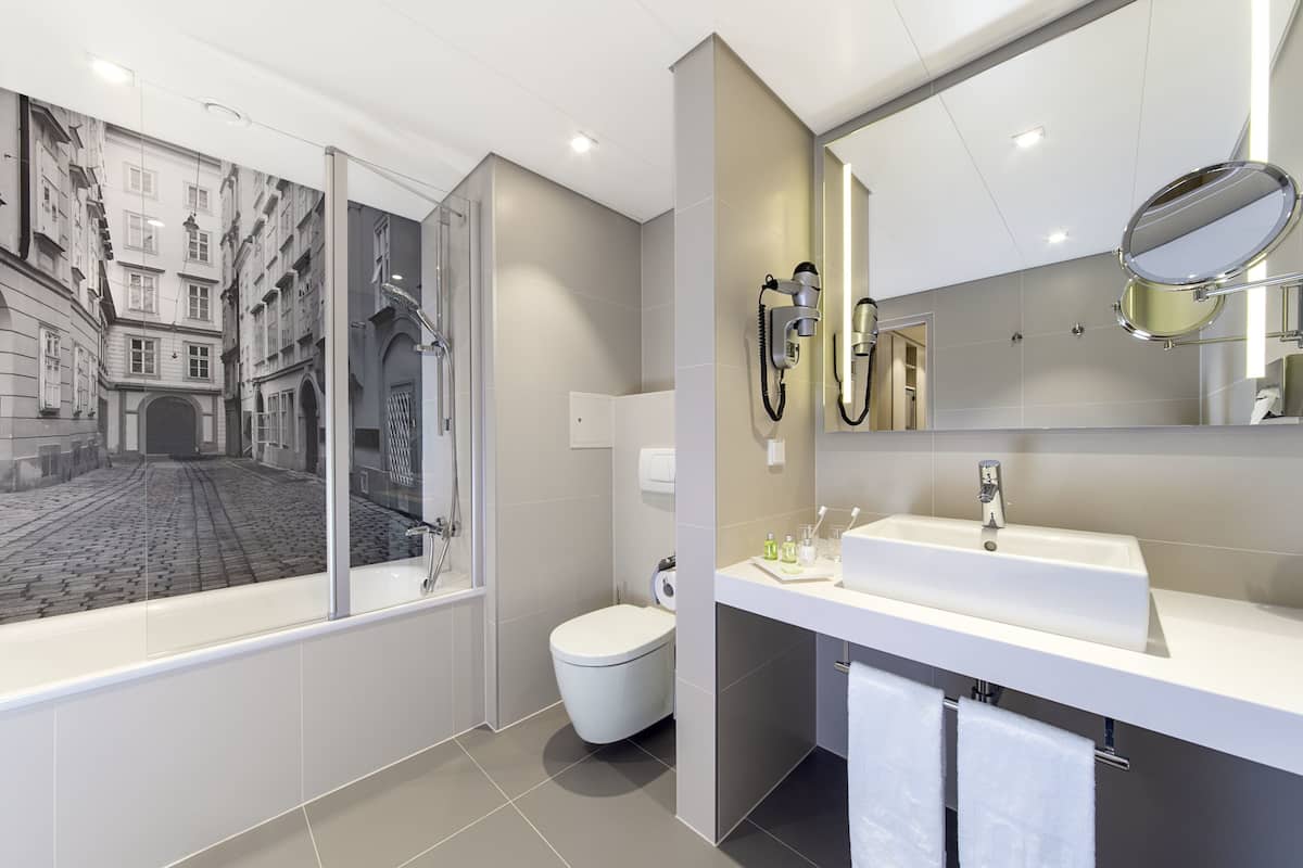 eco-friendly toiletries, hair dryer, bathrobes, slippers