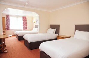 A hotel room with two single beds, a desk, and a chair. - Farmhouse Innlodge by Greene King Inns (Portsmouth)