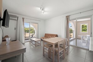 Deluxe Apartment, 1 Bedroom | Living area | 22-inch LCD TV with satellite channels, TV