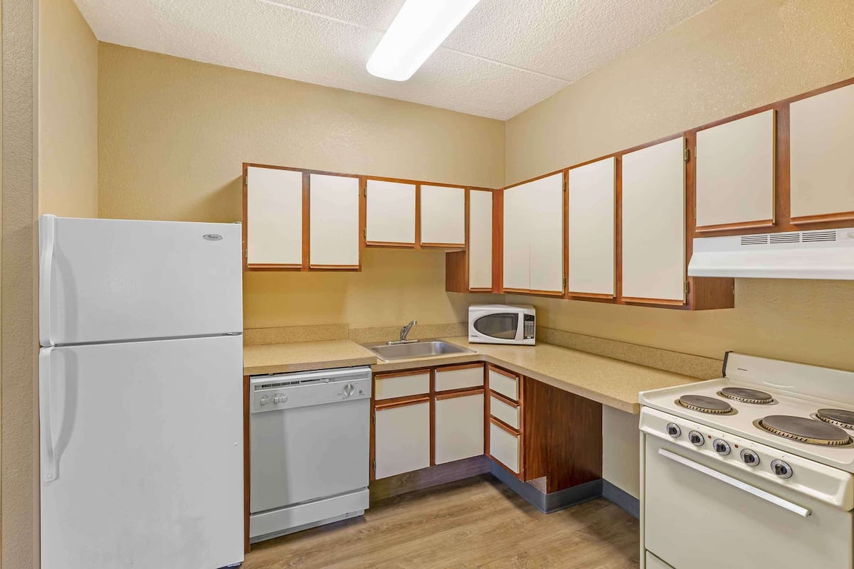 desk, laptop workspace, blackout curtains, iron/ironing board