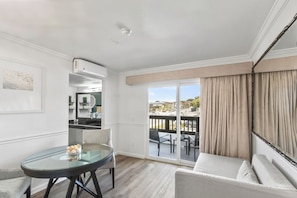 Studio Suite, Balcony (1 Bedroom) | Desk, blackout curtains, iron/ironing board, free WiFi