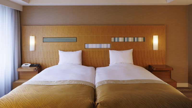 Deluxe Twin Room, Non Smoking | Minibar, in-room safe, desk, blackout drapes