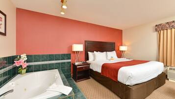 King Room with Jacuzzi Tub | In-room safe, desk, iron/ironing board, bed sheets