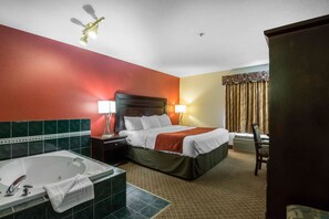 King Room with Jacuzzi Tub | In-room safe, desk, iron/ironing board, bed sheets