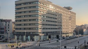 A multi-story hotel with a modern design, featuring a prominent glass facade and a flat roof. - NH Collection Milano Porta Nuova (Milan)