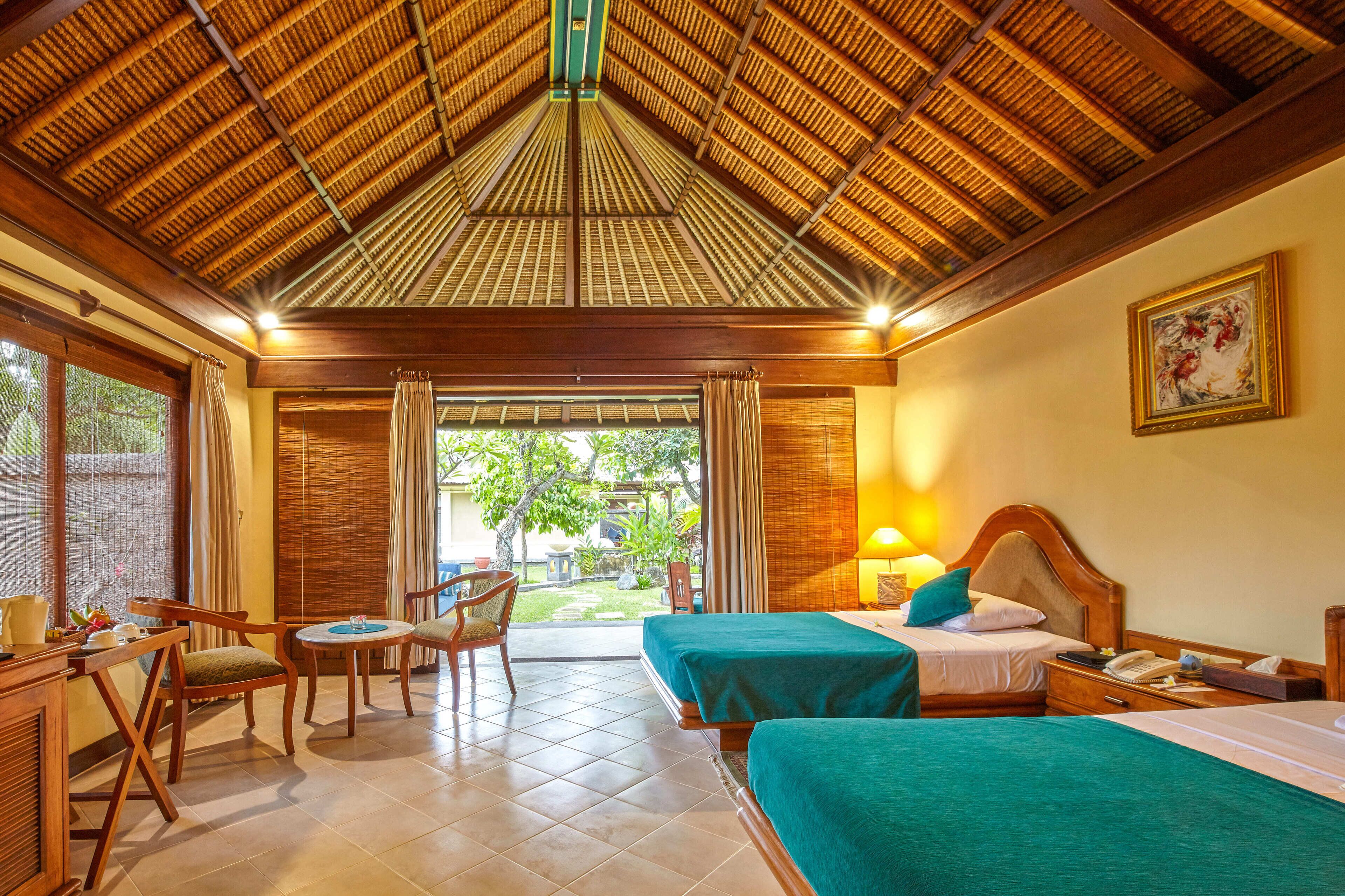 deluxe room, garden view, garden area | 1 bedroom, premium bedding, select comfort beds, minibar