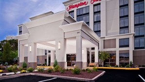 A Hampton Inn hotel with a modern facade, a covered entrance, and a landscaped garden area. - Hampton Inn by Hilton Shelton (Shelton)