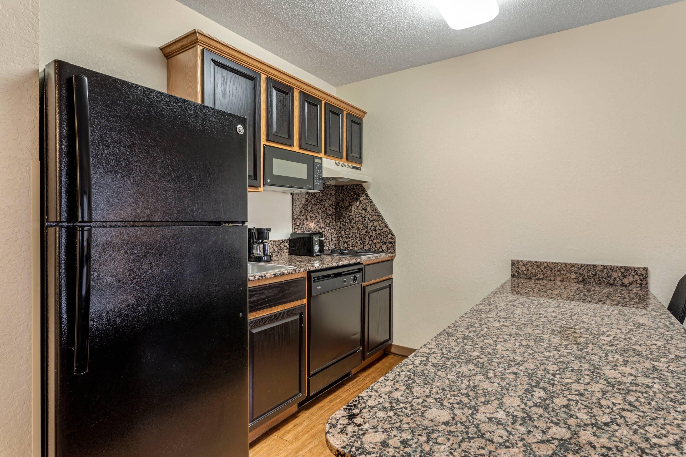 Standard Suite (2 Queen Beds with Sofabed) | Desk, laptop workspace, blackout drapes, iron/ironing board