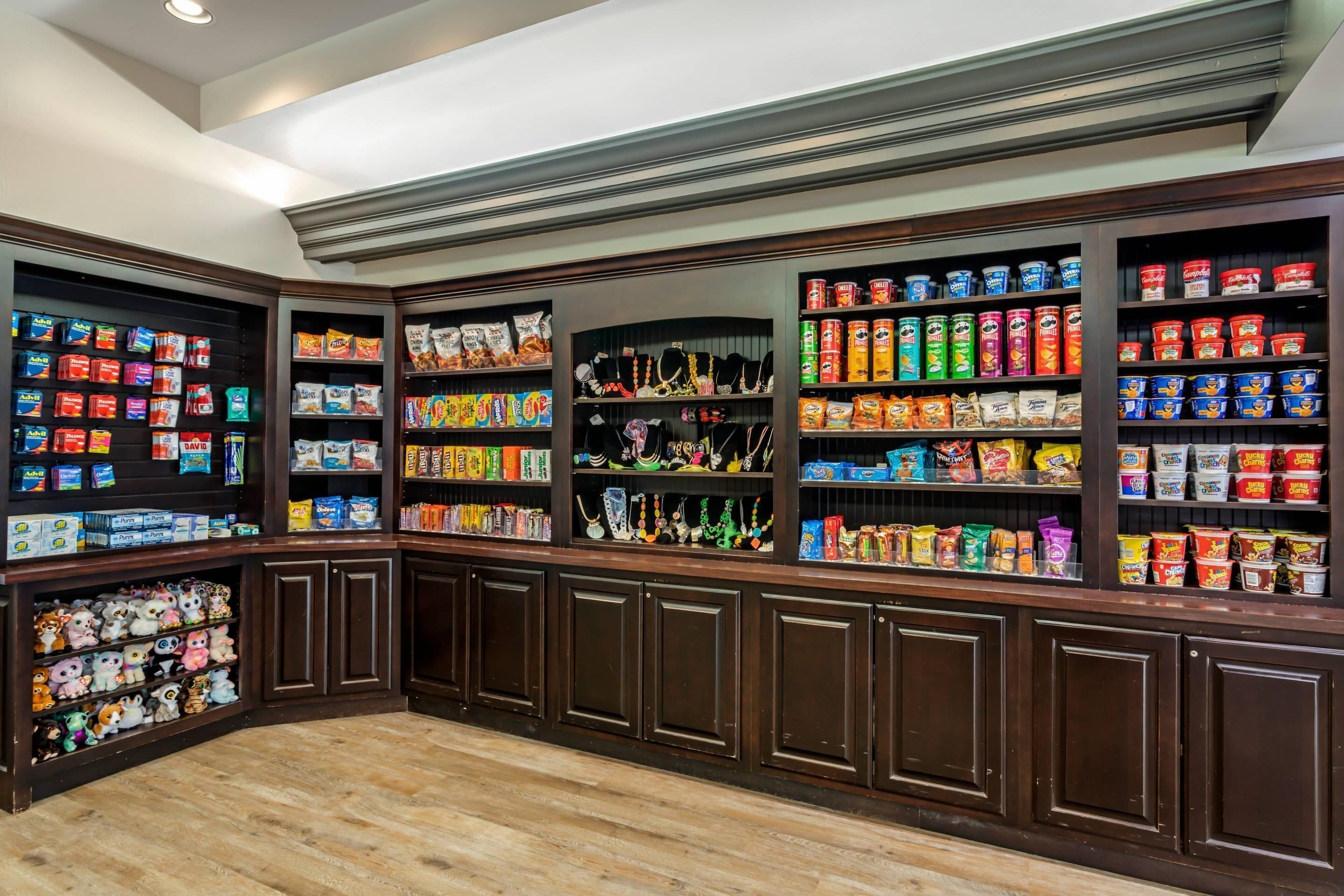 A well-organized pantry with shelves stocked with various food items and snacks.