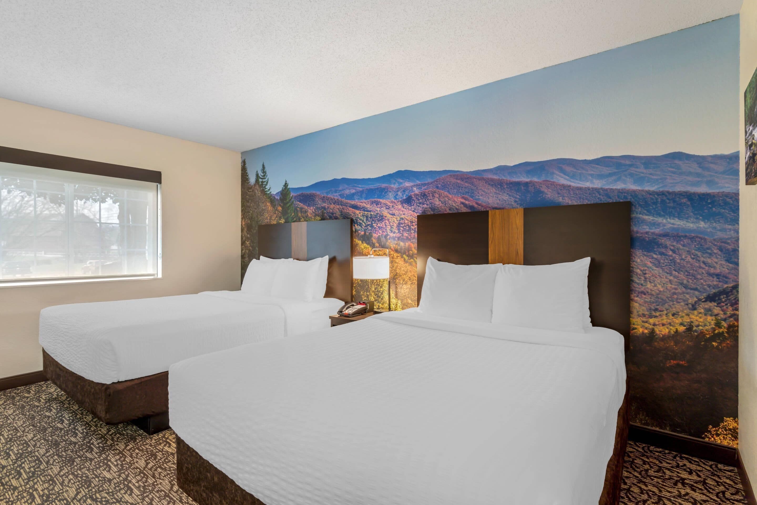 Standard Suite (2 Queen Beds with Sofabed) | Desk, laptop workspace, blackout drapes, iron/ironing board