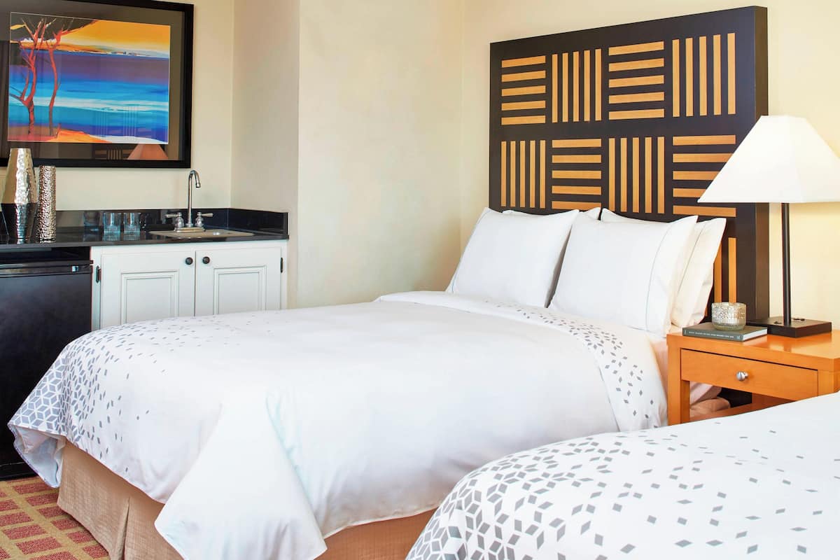 Premium bedding, down comforters, pillowtop beds, minibar
