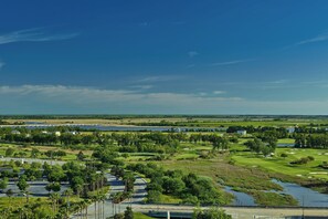 A golf course with a water body, trees, and a bridge. - The Westin Savannah Harbor Golf Resort & Spa (Savannah)