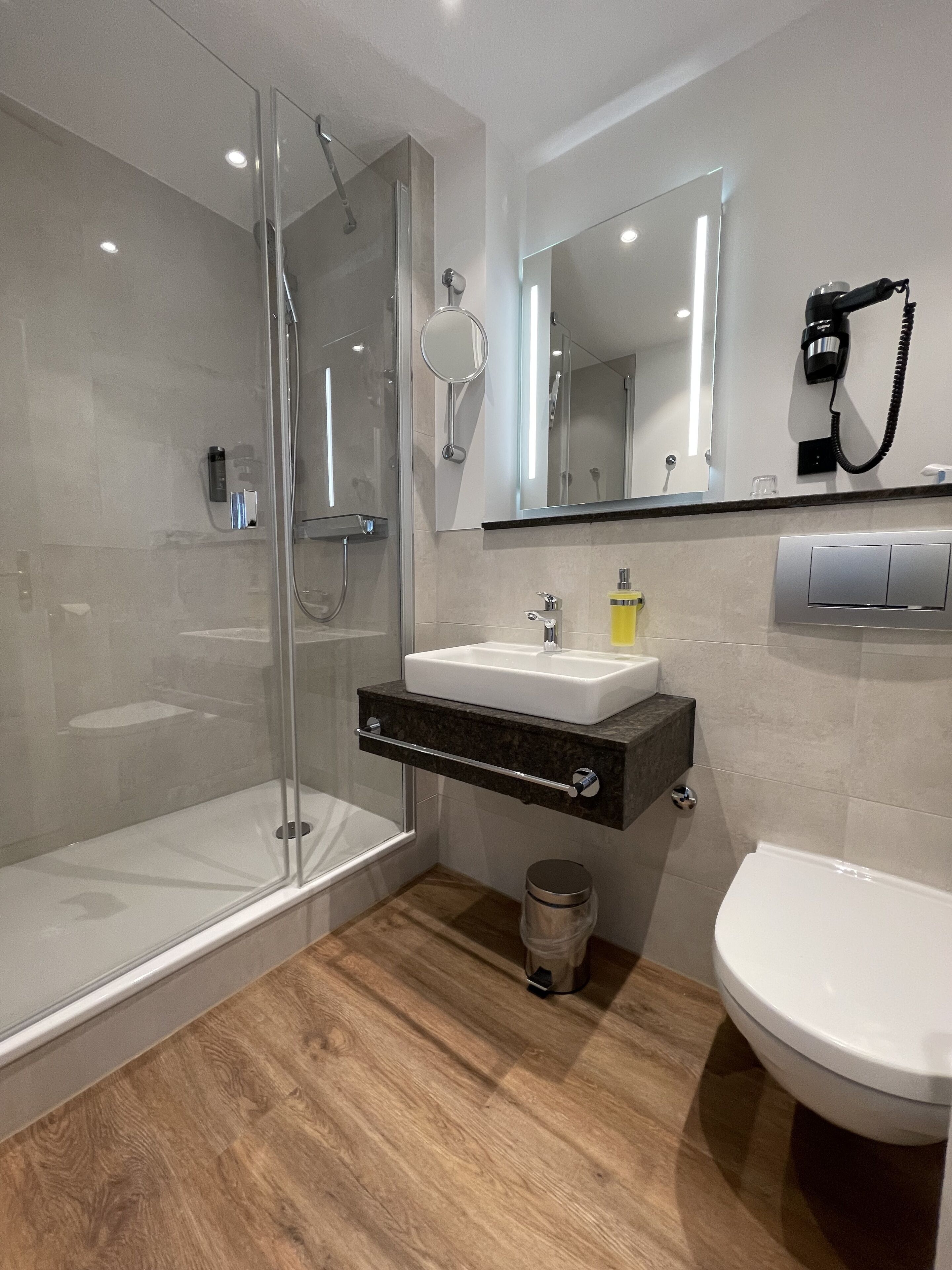 premium single room | bathroom | shower, free toiletries, hair dryer, towels