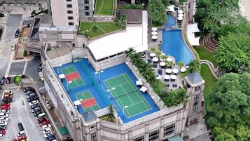 Enjoy a game of tennis or a refreshing swim at this property, which offers a rooftop tennis court and a pool area surrounded by lush greenery.