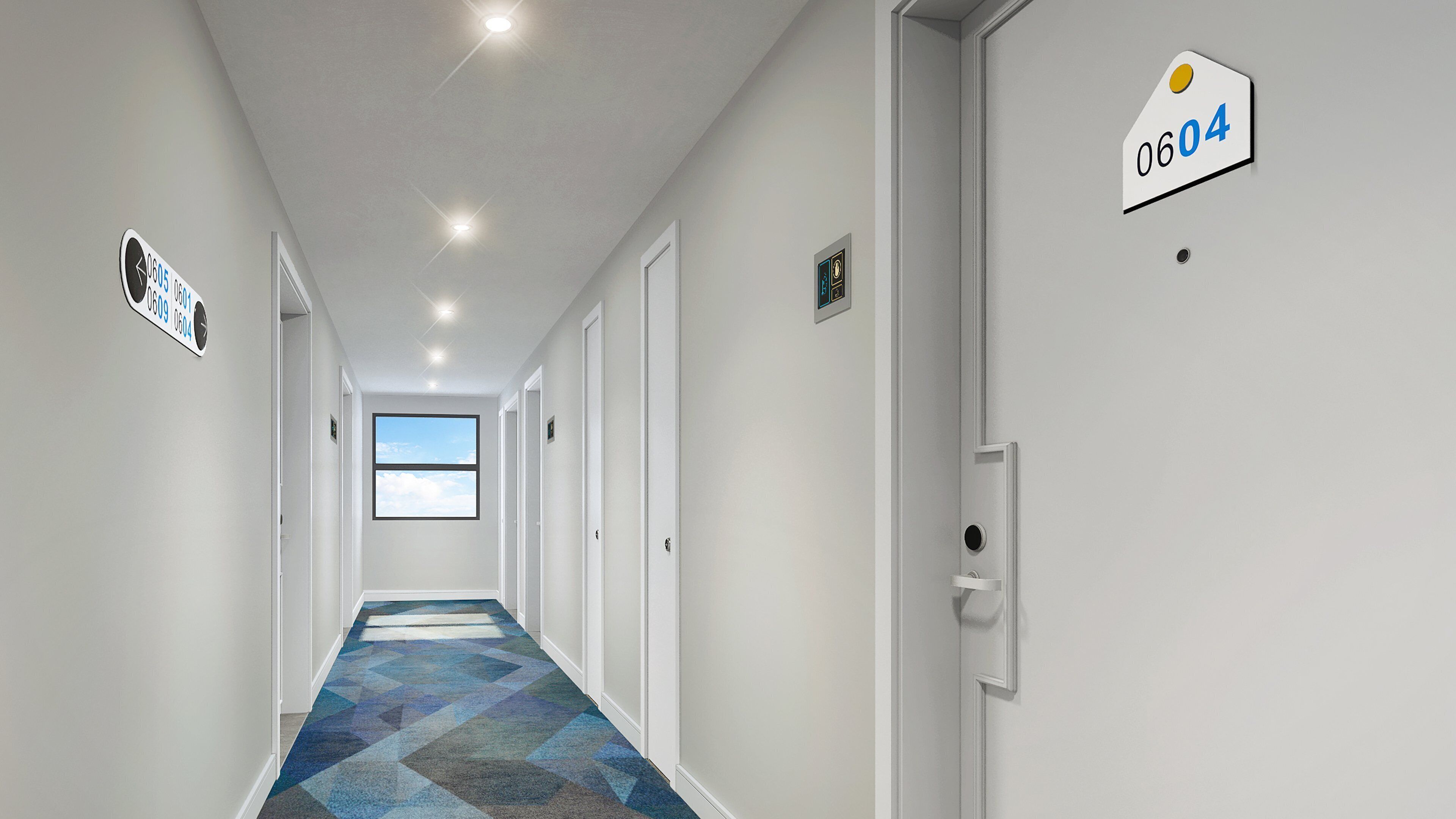 A modern hotel hallway with a geometric patterned carpet, white walls, and doors numbered 0605, 0601, 0609, 0604.