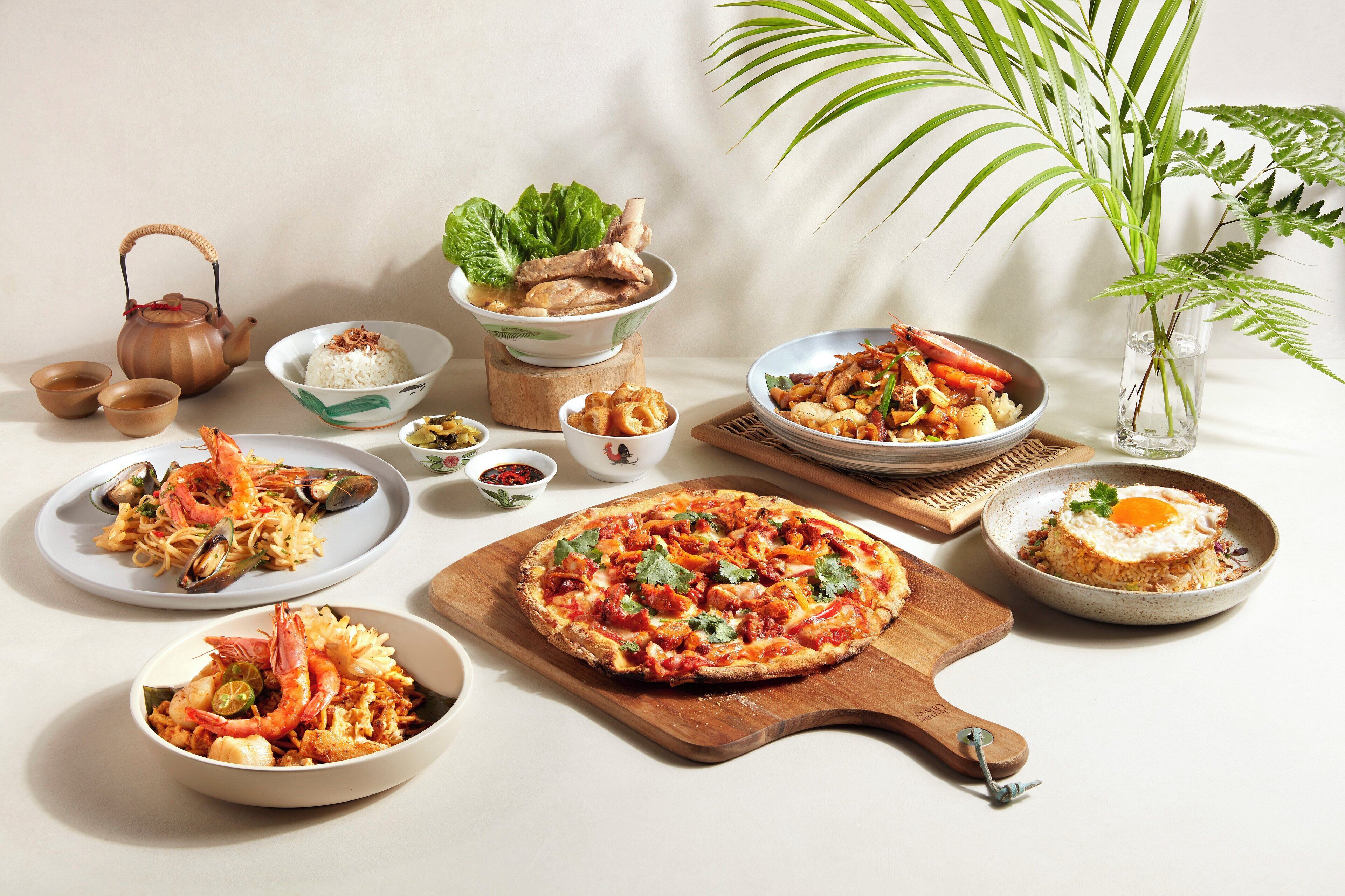 A variety of dishes including seafood pasta, a pizza, and rice with egg.