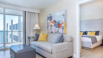 Pool View Suite | Living area | 42-inch flat-screen TV with cable channels, TV, pay movies