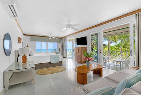 Beachfront Suite | Living area | 40-inch flat-screen TV with digital channels, TV. Couples Negril All Inclusive