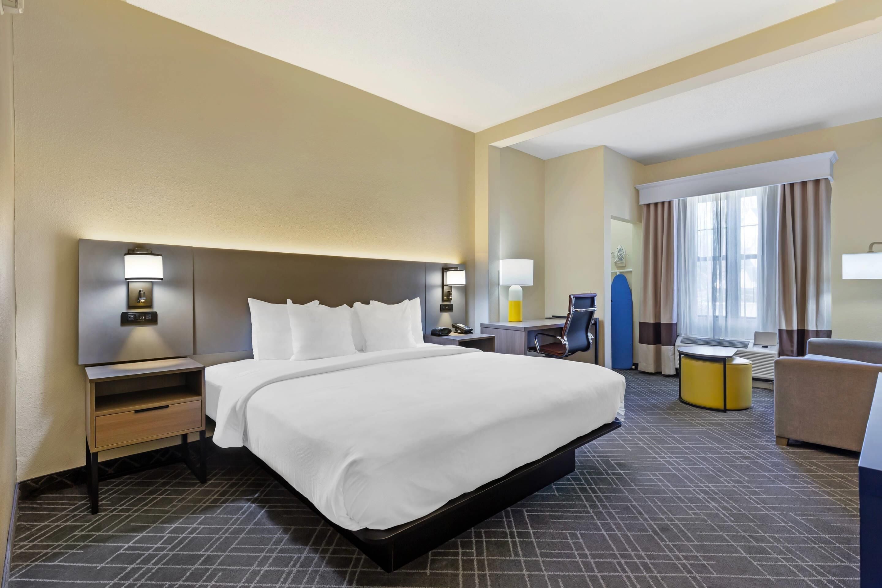 pillow-top beds, desk, laptop workspace, blackout curtains