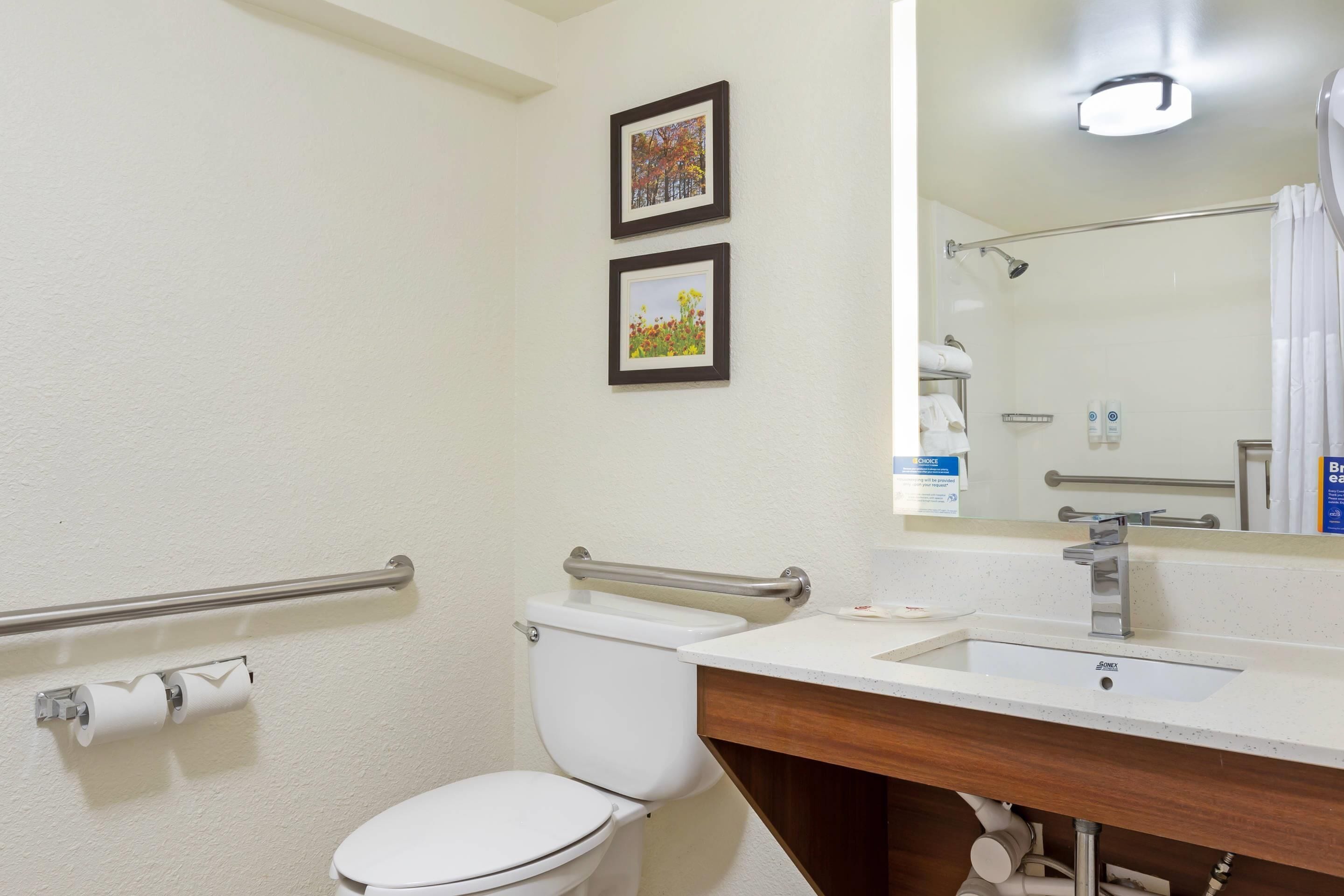 pillow-top beds, desk, laptop workspace, blackout curtains