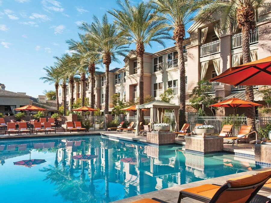 Outdoor pool, open 6 AM to 10:00 PM, pool umbrellas, pool loungers