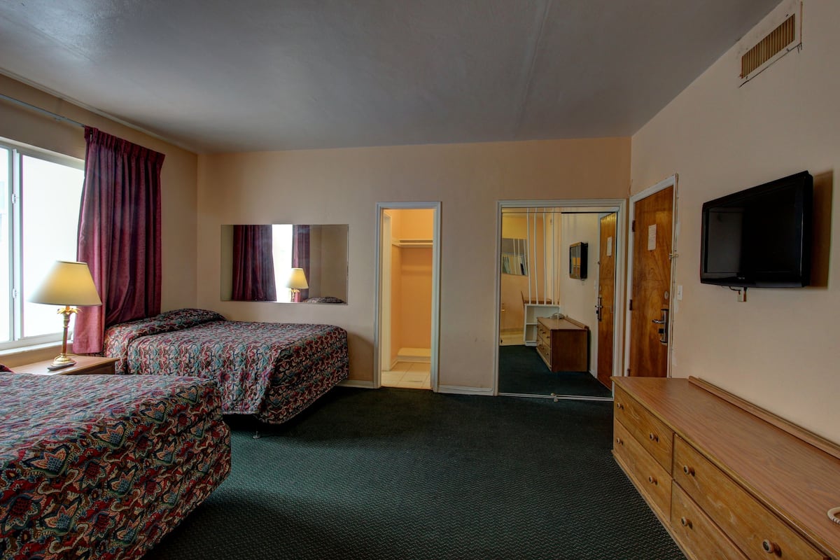Suite, 2 Double Beds | In-room safe, blackout drapes, soundproofing, iron/ironing board