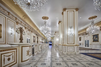 A lobby with a green wall, a Napoleon