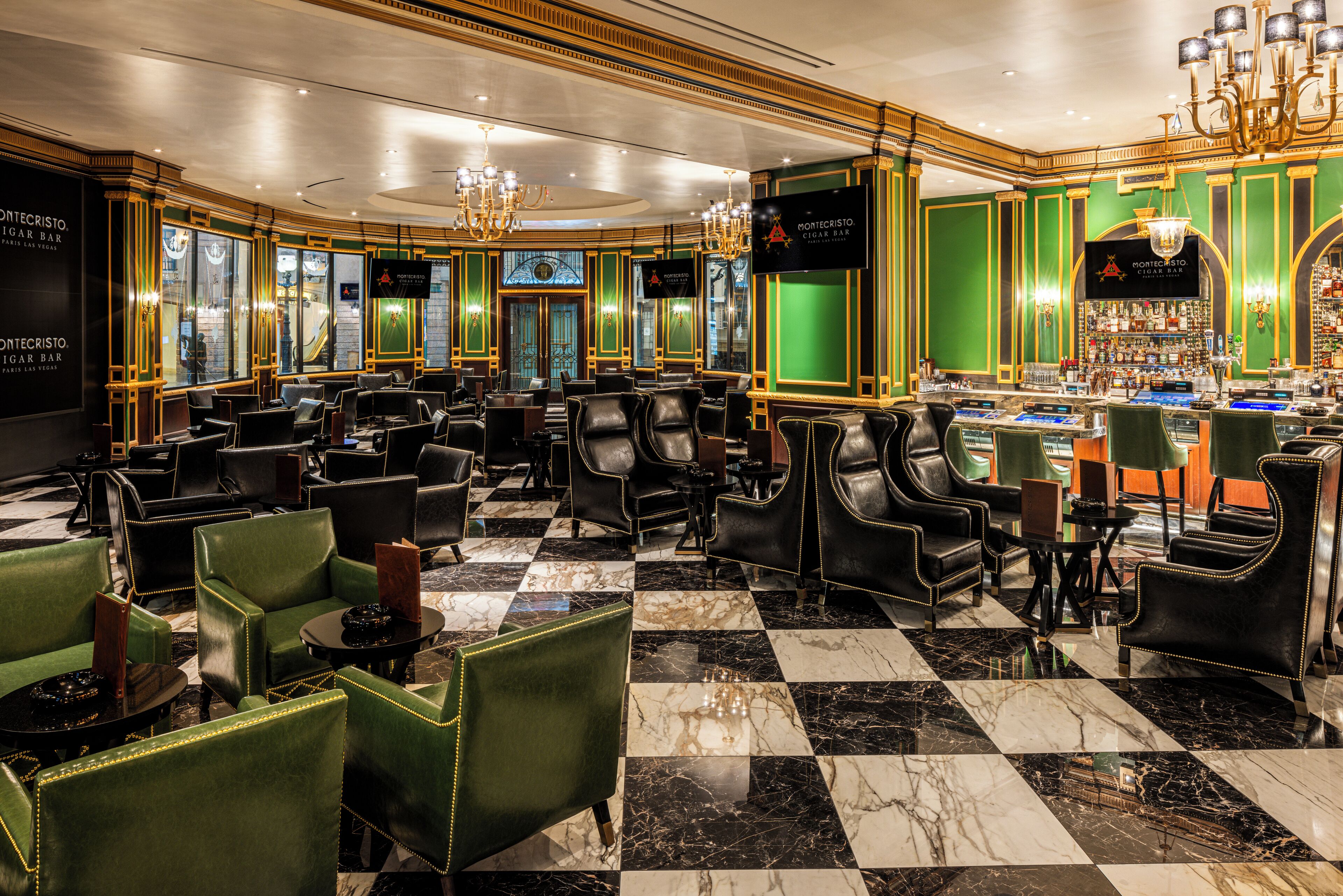 A bar area with leather chairs, a checkered floor, and a bar counter.