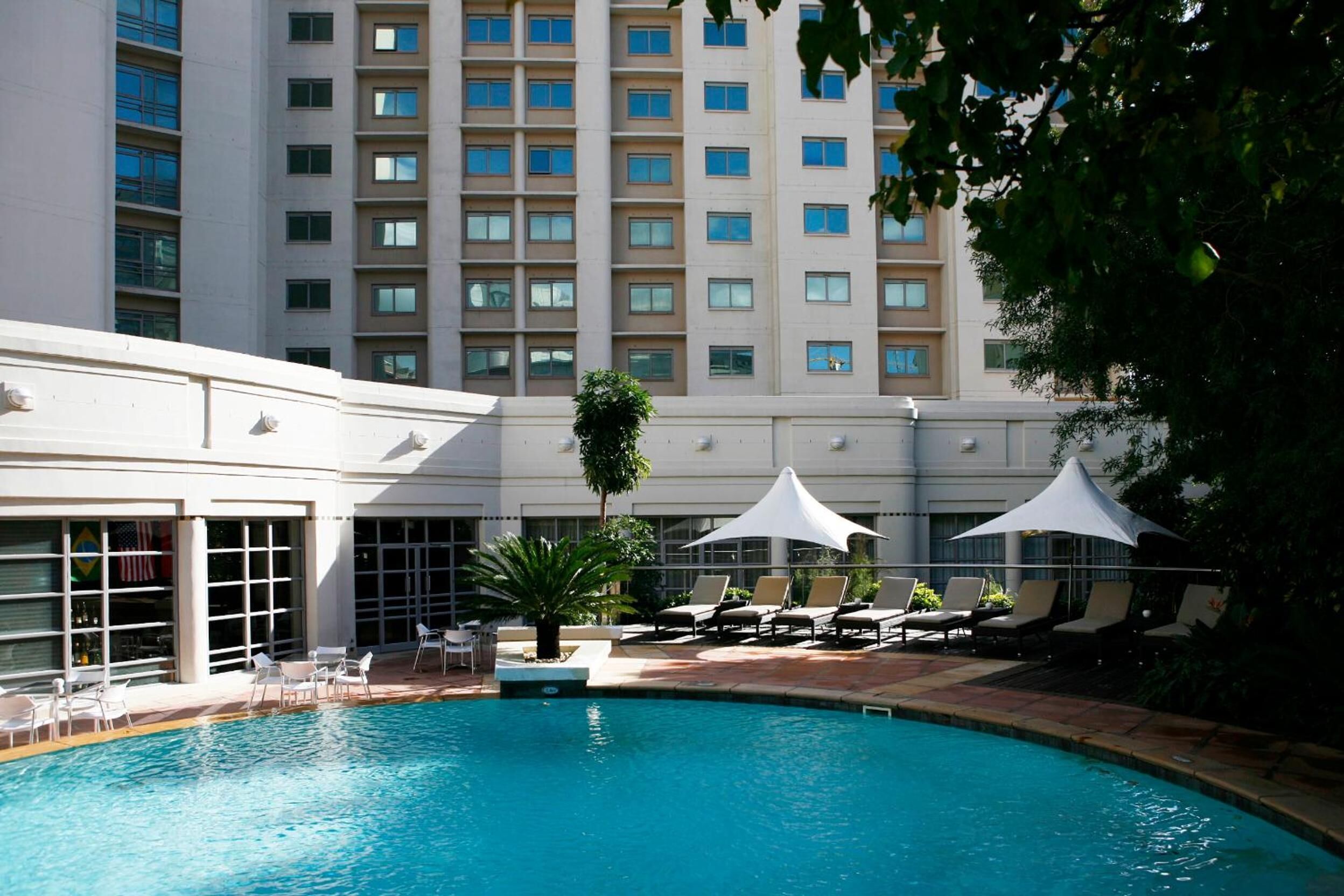 outdoor pool, open 6:00 am to 8:00 pm, pool umbrellas, pool loungers