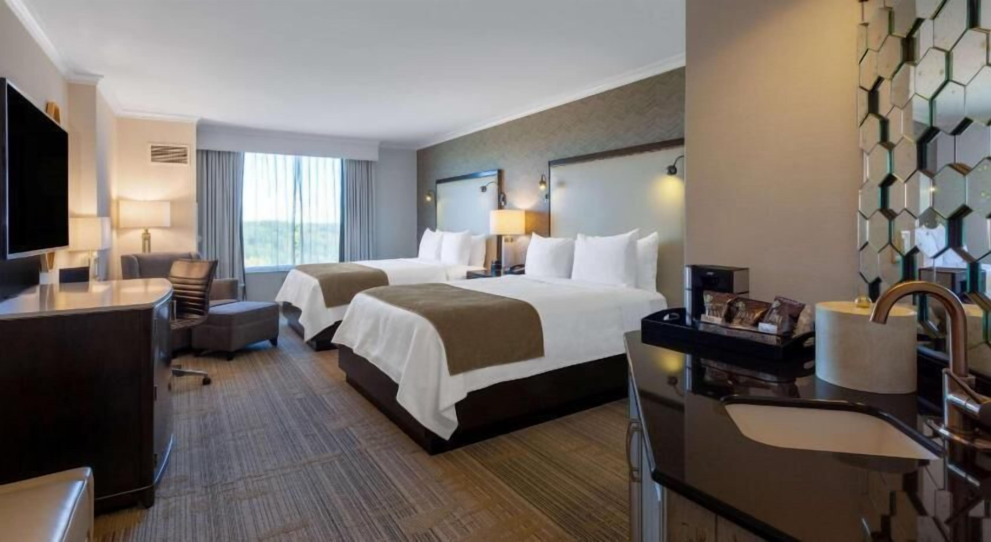 Premium bedding, down comforters, pillowtop beds, in-room safe