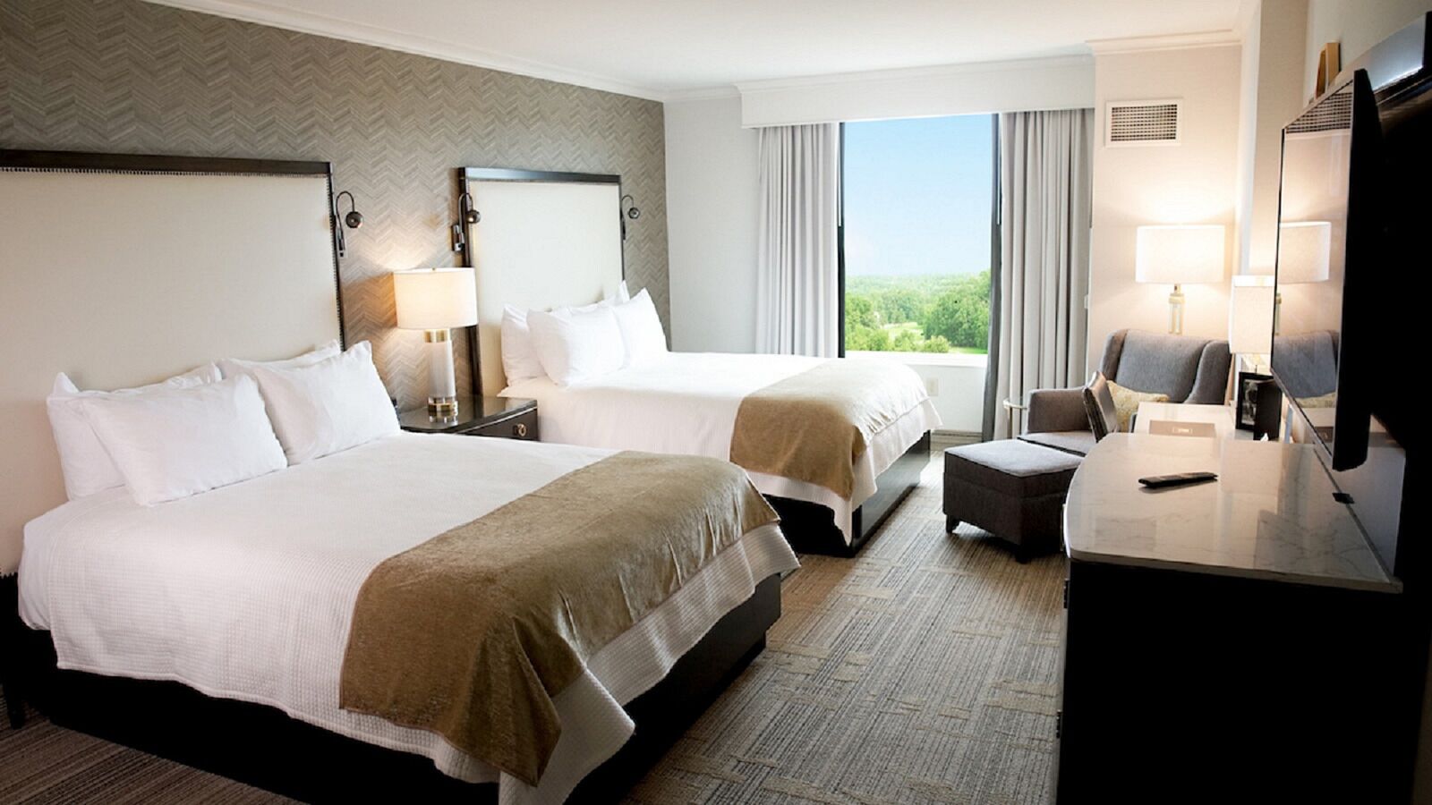 Premium bedding, down comforters, pillowtop beds, in-room safe
