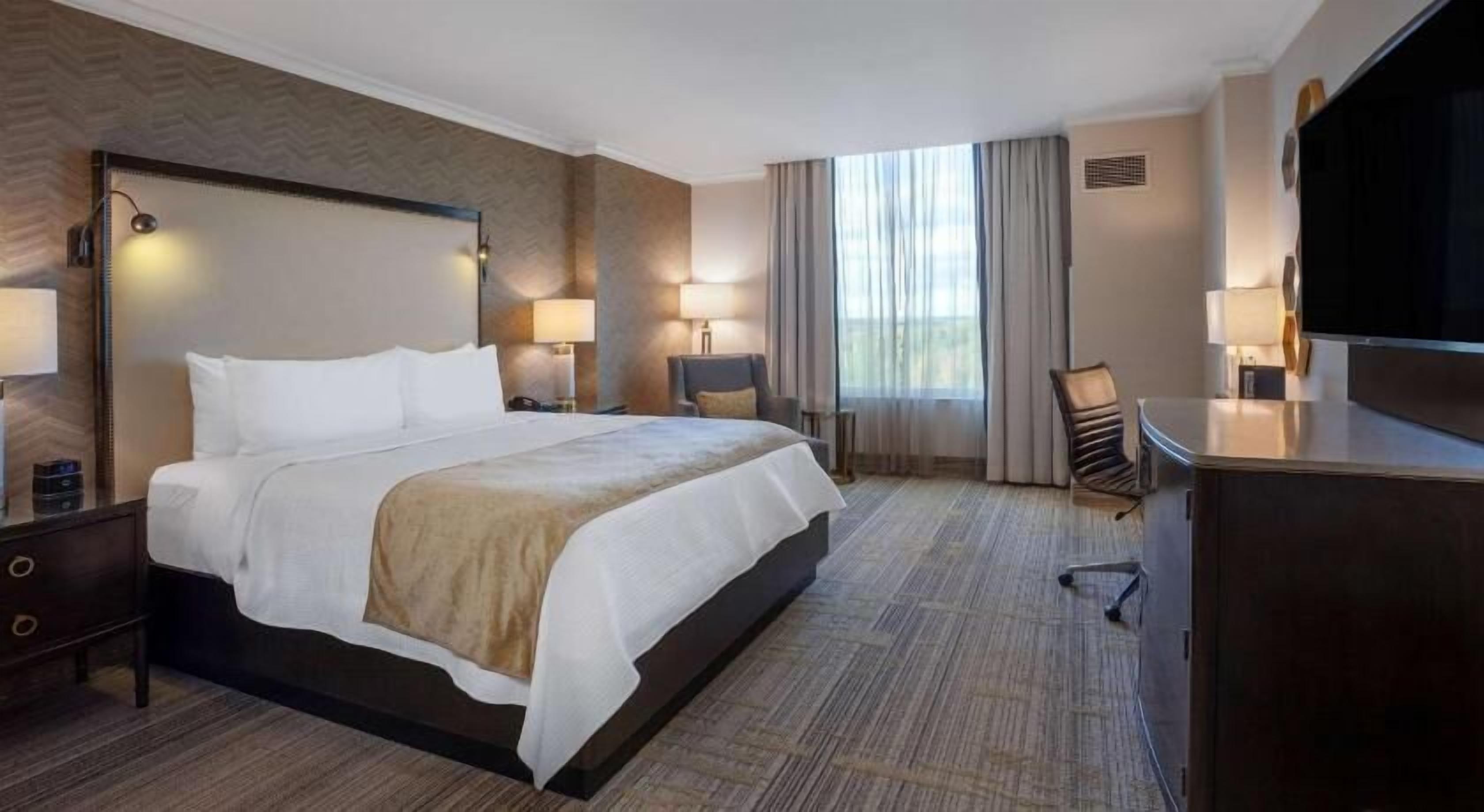 Premium bedding, down comforters, pillowtop beds, in-room safe