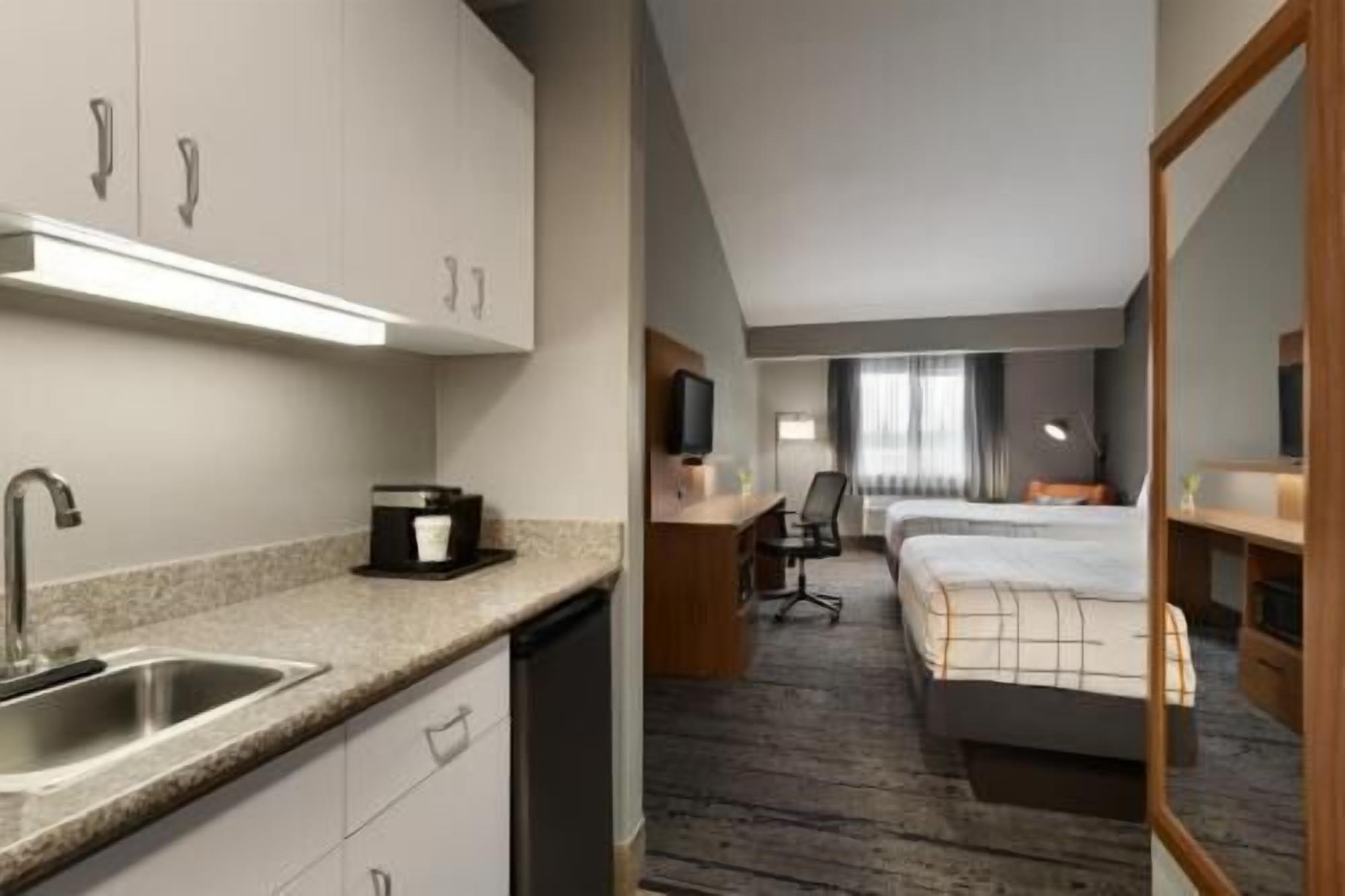 Premium bedding, desk, laptop workspace, blackout drapes