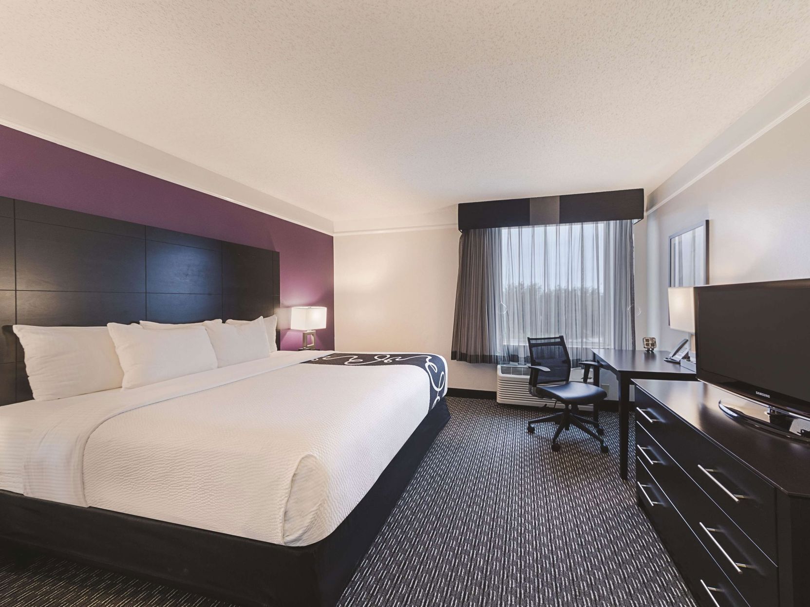 Premium bedding, pillowtop beds, desk, laptop workspace