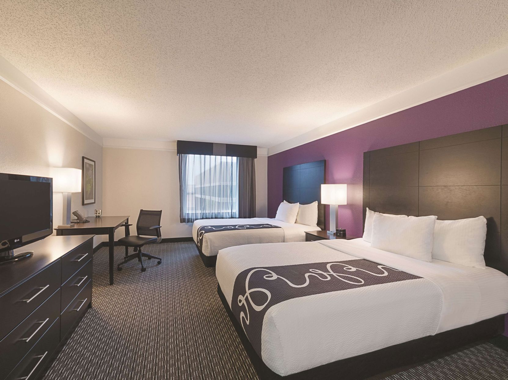Premium bedding, pillowtop beds, desk, laptop workspace