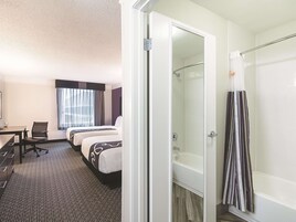 Premium bedding, pillow-top beds, desk, laptop workspace