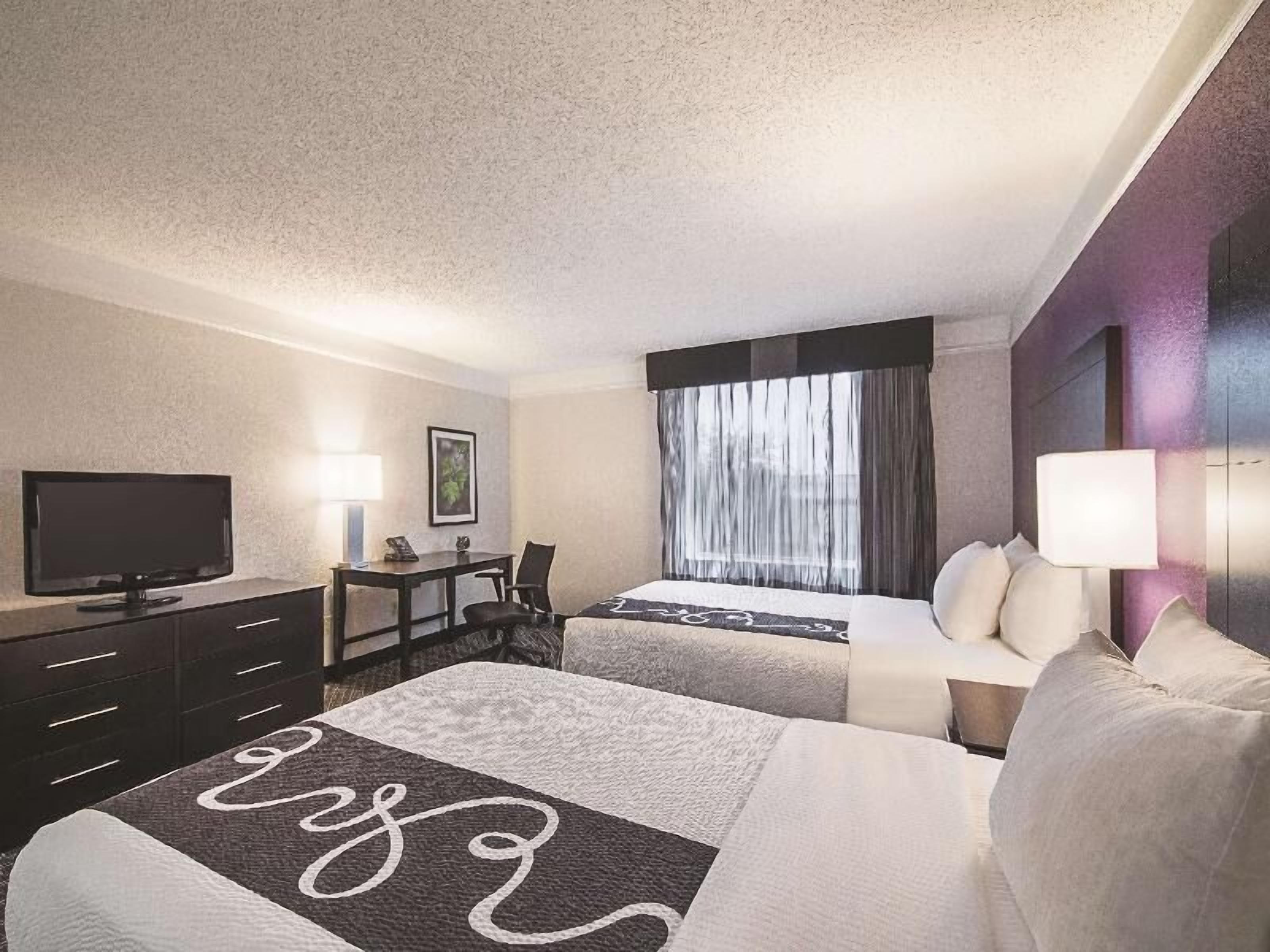 Premium bedding, pillowtop beds, desk, laptop workspace