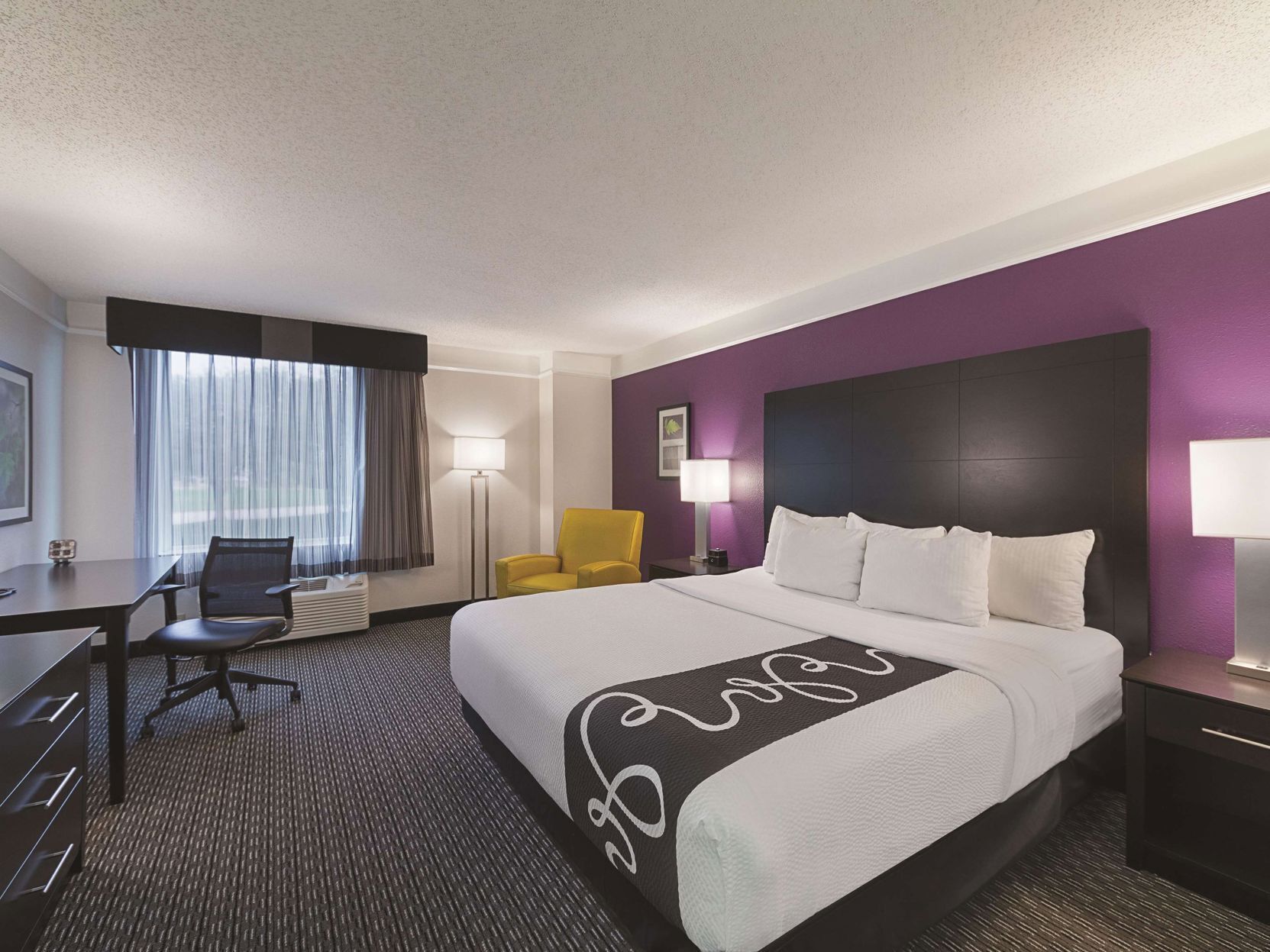 Premium bedding, pillowtop beds, desk, laptop workspace
