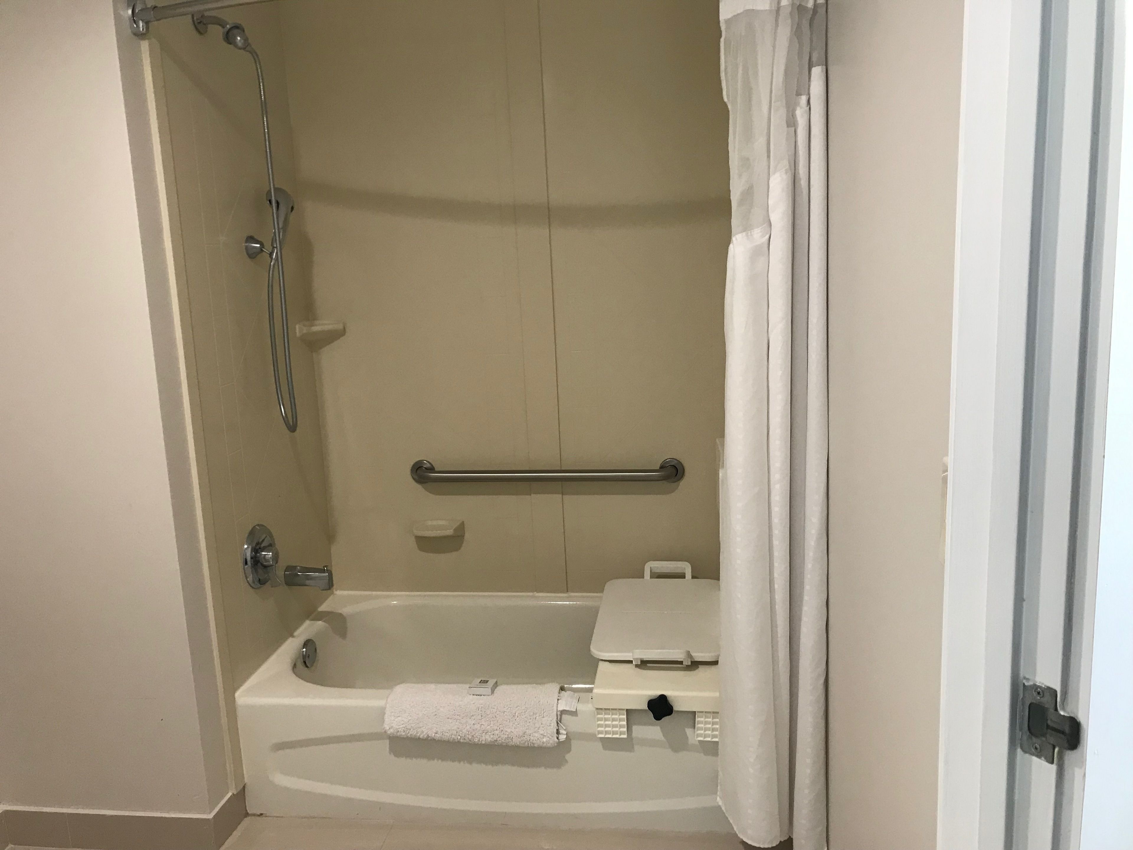 A bathroom with a bathtub, a shower, and a toilet.