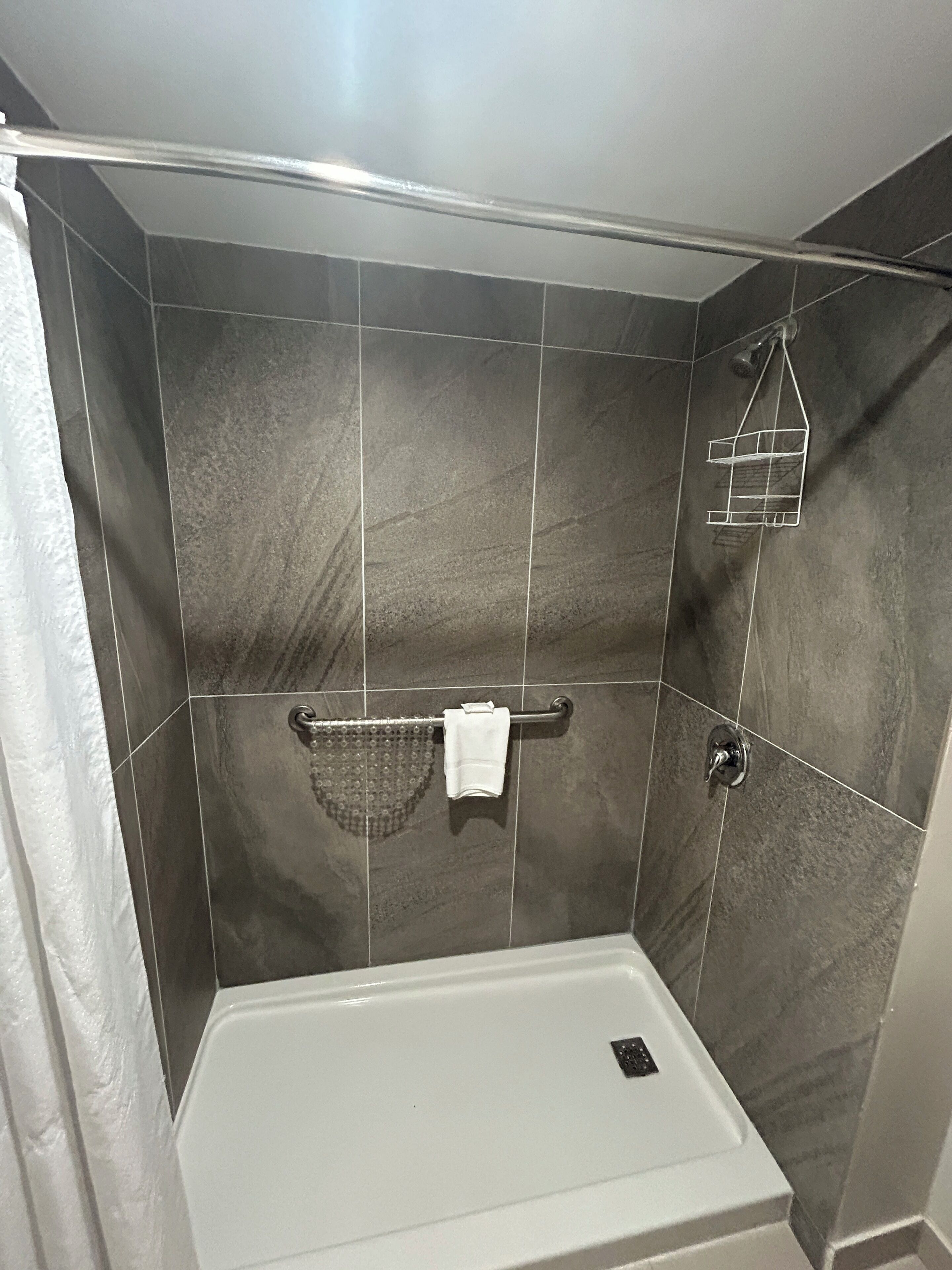 suite, 1 bedroom, non smoking, corner (living room) | bathroom | combined shower/bathtub, free toiletries, hair dryer, towels