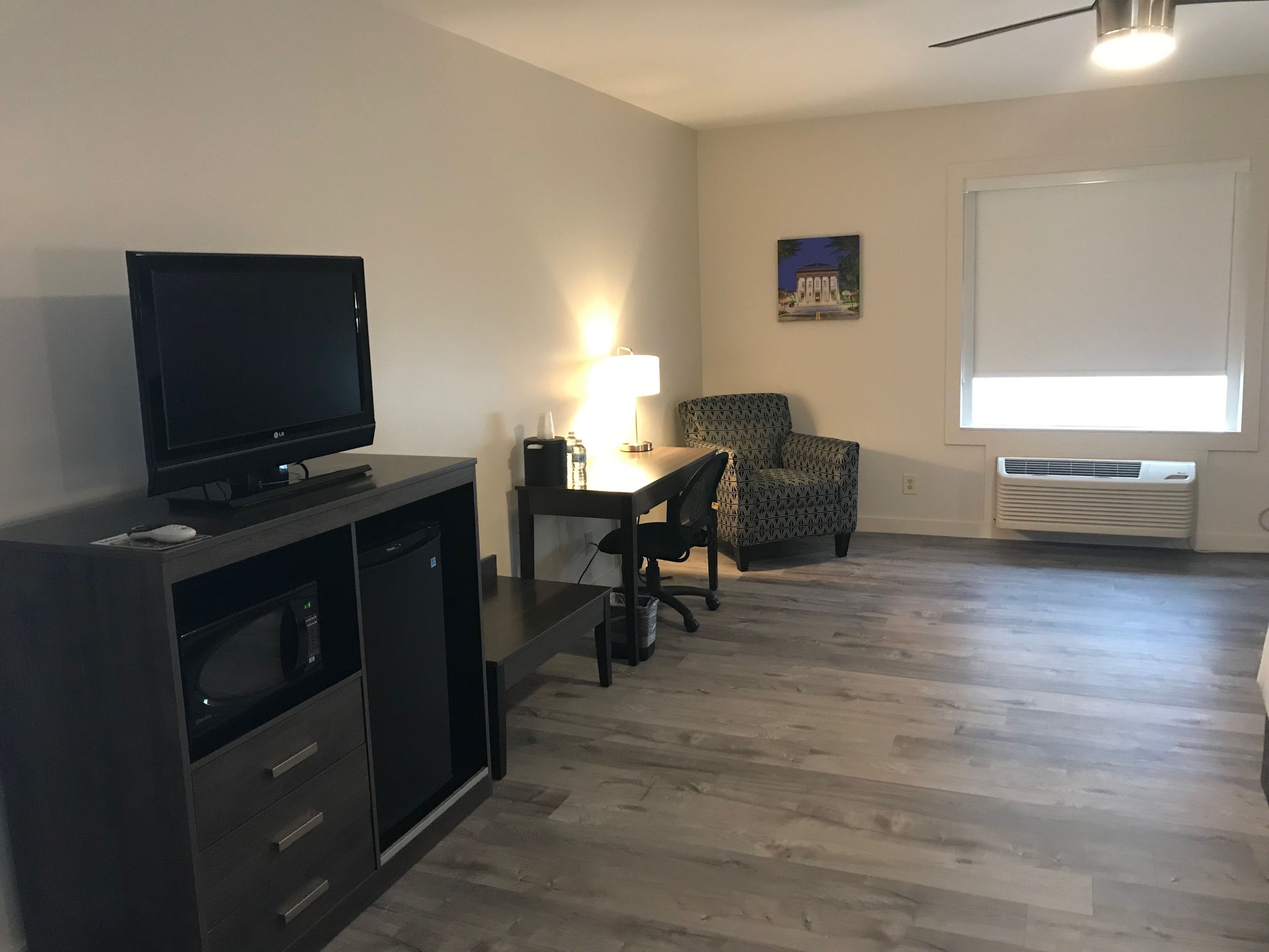 deluxe room, 1 king bed, non smoking | premium bedding, desk, blackout curtains, iron/ironing board