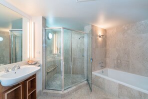 Combined shower/bathtub, designer toiletries, hair dryer, bathrobes