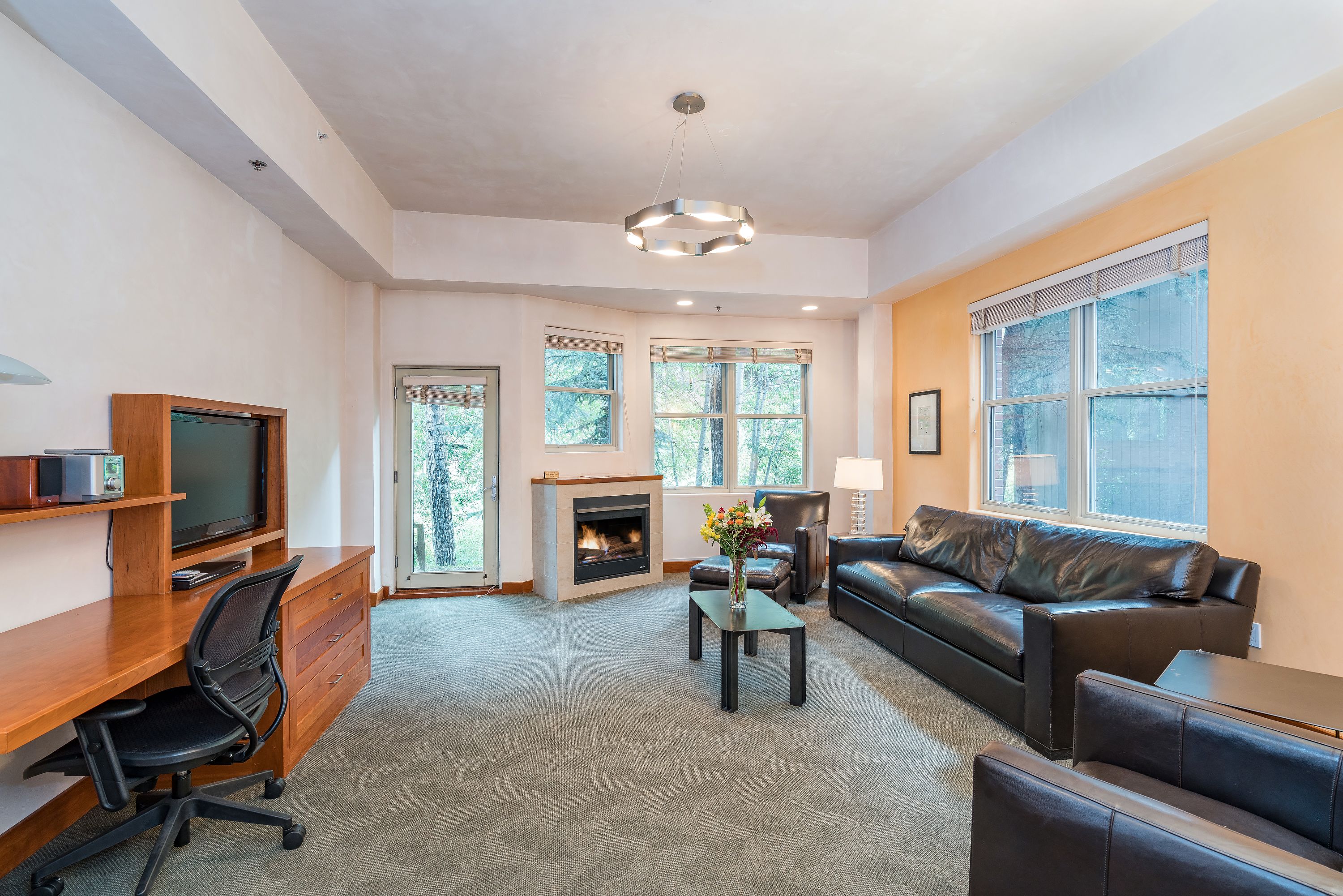 suite, 2 queen beds | living room | 42-inch flat-screen tv with cable channels, tv, fireplace